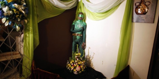 The dead body of a portorican man stands up at his funeral dressed up as a marvel hero
